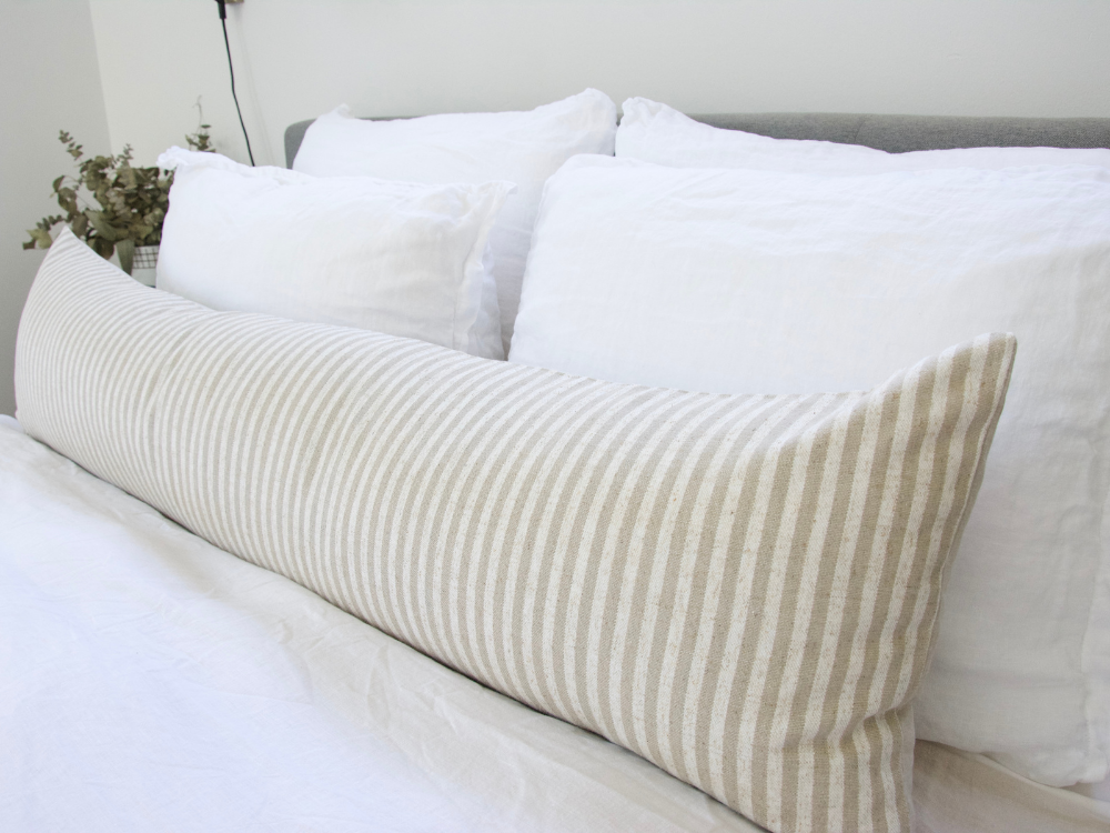 https://www.homies.la/cdn/shop/products/LargeTaupe_WhiteStripedExtraLongLumbarPillow-14x50-1_1024x.png?v=1699043387